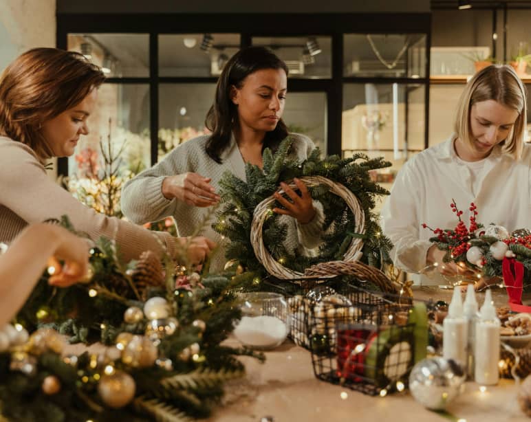 Group of women participating in a christmas wreath workshop
